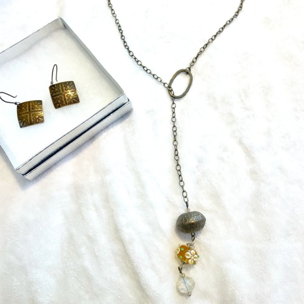 Asian-inspired brass earrings and necklace set from local boutique